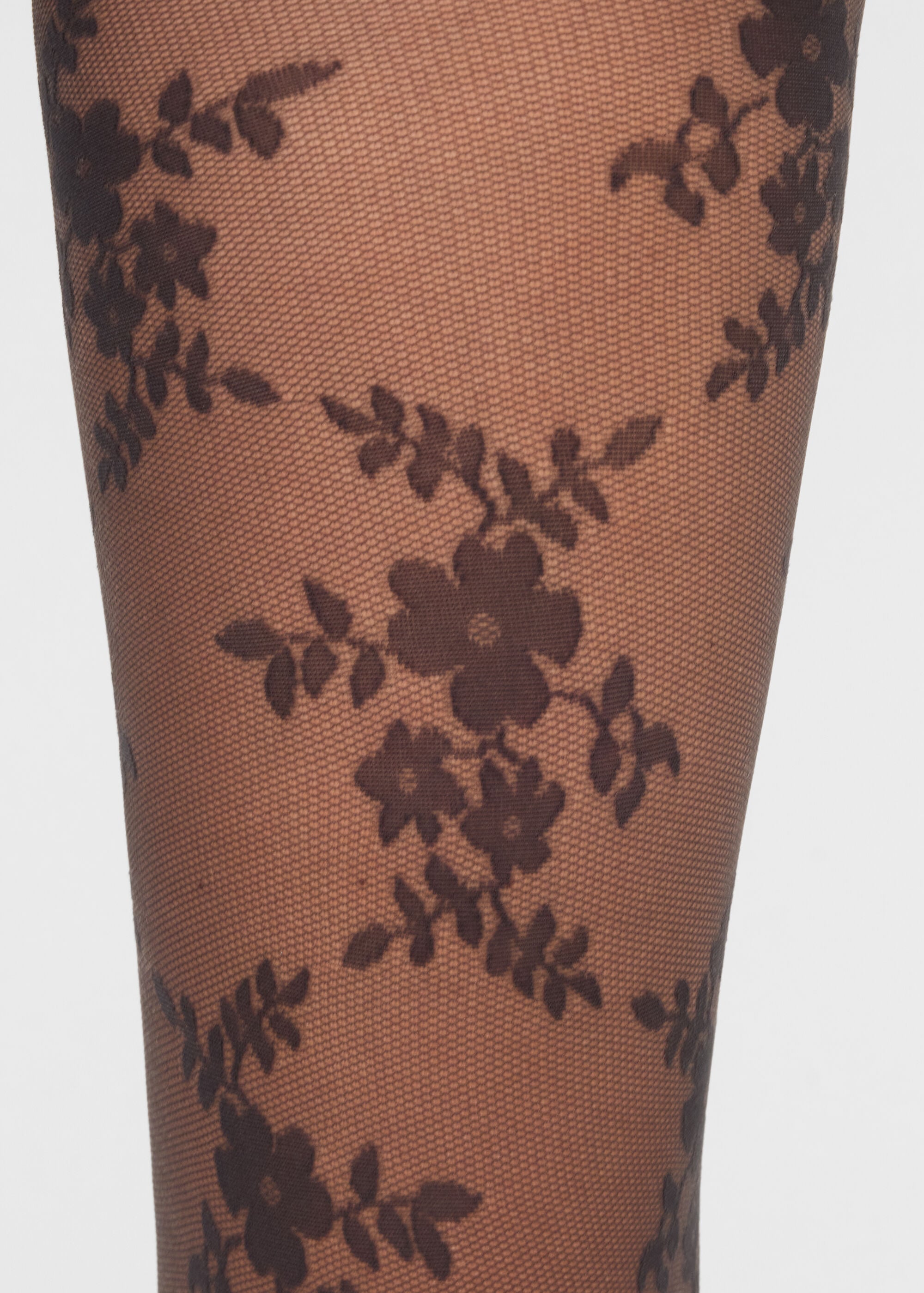 Transparente Strumpfhose aus Blumenspitze